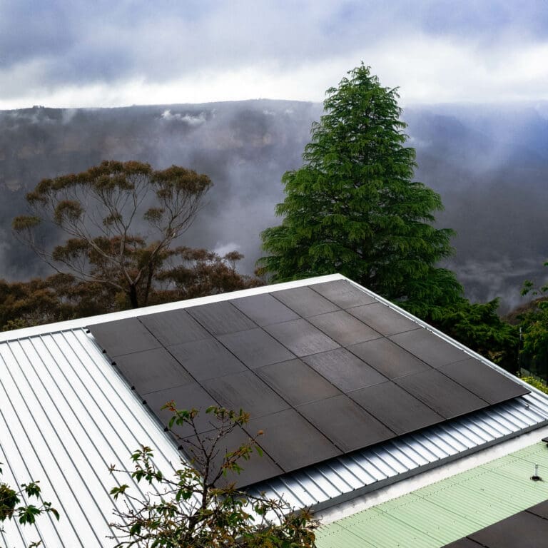 A solar panel on the roof of a house.