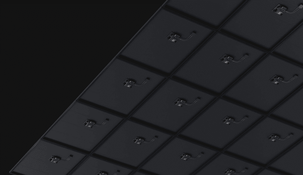 An image of a black wall with a lot of lights on it.