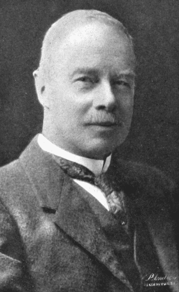 Black and white portrait of a middle-aged man in vintage attire.