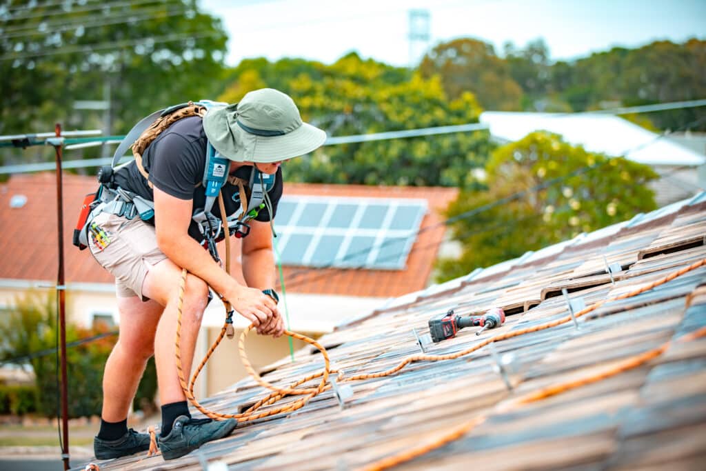 A man working on a roof.