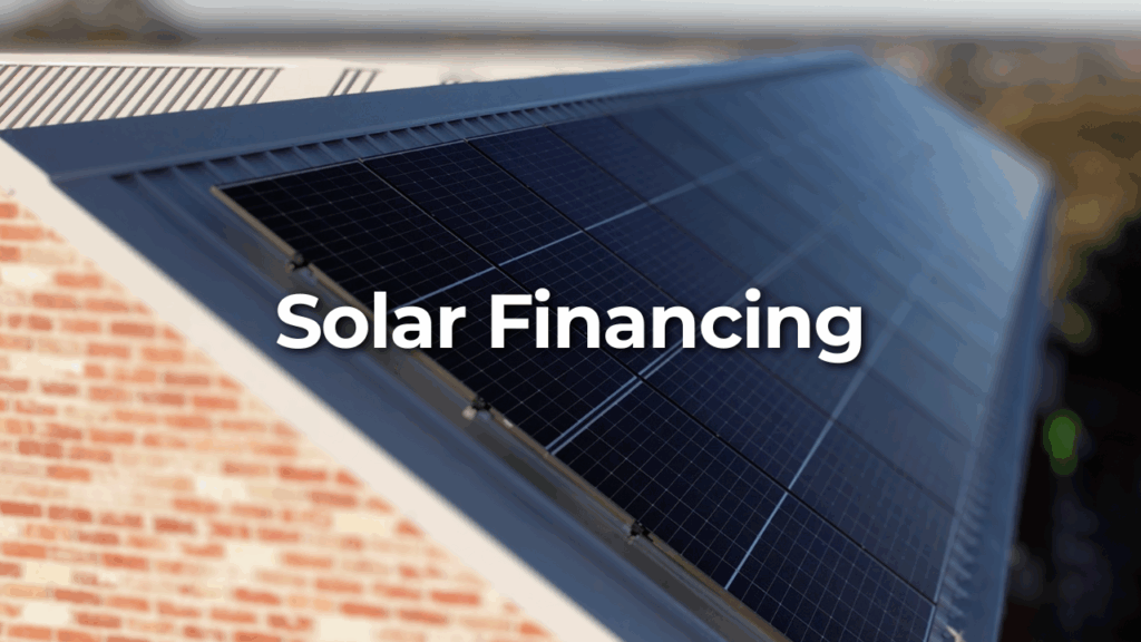 Solar panels installed on a sloped roof of a brick building with the words "Solar Financing" overlaid in large white text.