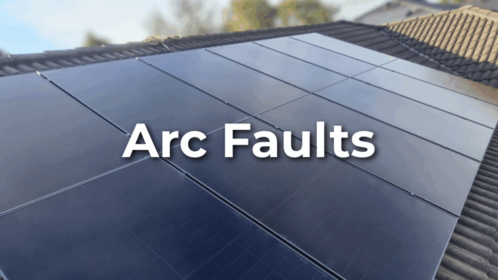 Close-up view of solar panels installed on a rooftop with the words “Arc Faults” overlaid in bold white text.