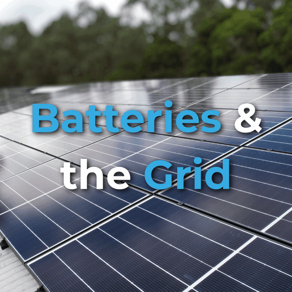 Close-up of solar panels outdoors with the text "Batteries & the Grid" overlaid in large blue and white font. Trees are visible in the background.