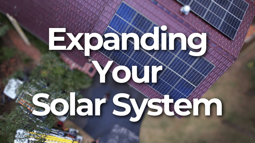 Text "Expanding Your Solar System" over a rooftop with solar panels and a blurred background.