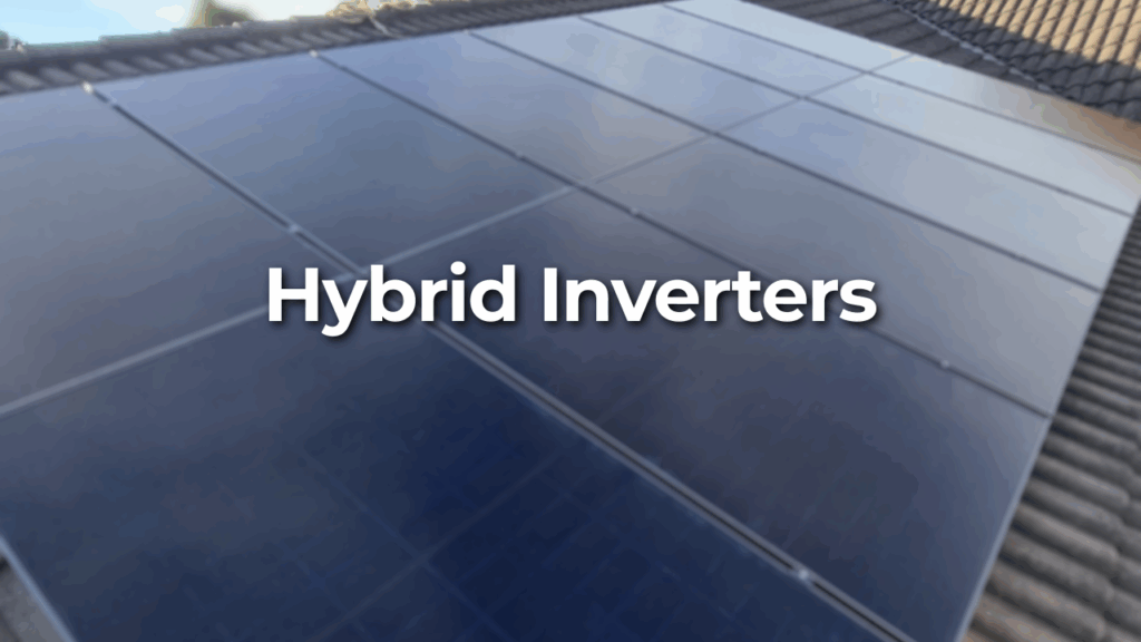 Solar panels installed on a rooftop with the words "Hybrid Inverters" overlaid in bold white text.