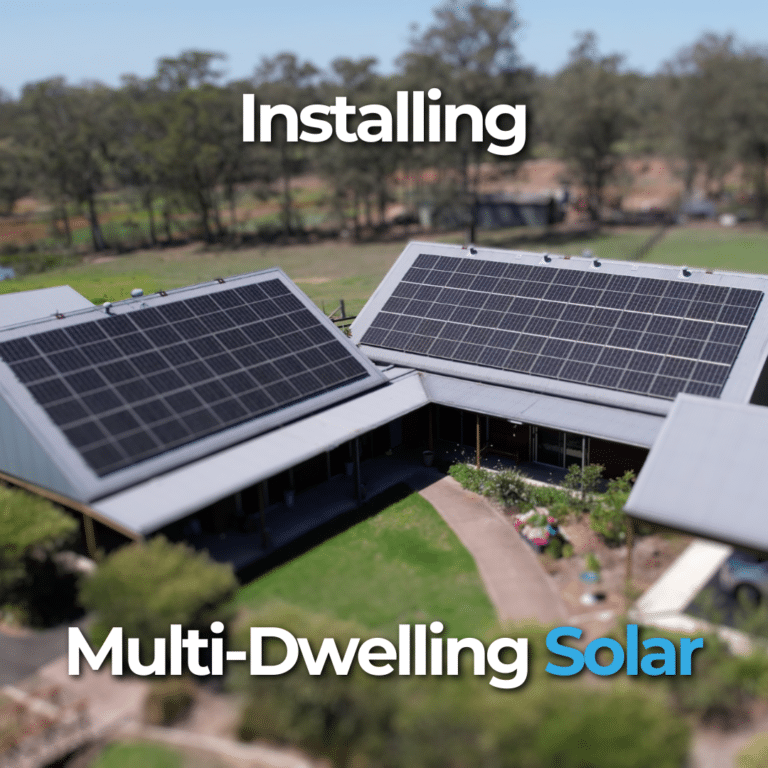 Aerial view of a multi-dwelling building with solar panels on the roof. Surrounding area includes trees and greenery. Text reads, "Installing Multi-Dwelling Solar.