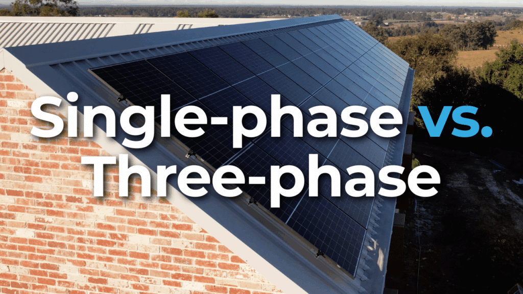 Solar panels installed on a sloped roof with text reading "Single-phase vs. Three-phase" in large font across the image.