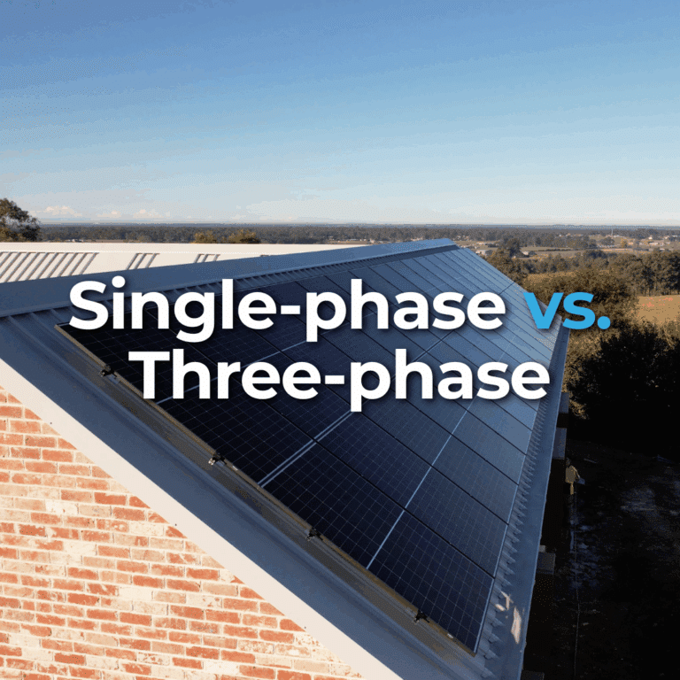 Solar panels installed on a sloped rooftop with the text "Single-phase vs. Three-phase" overlaid on the image.