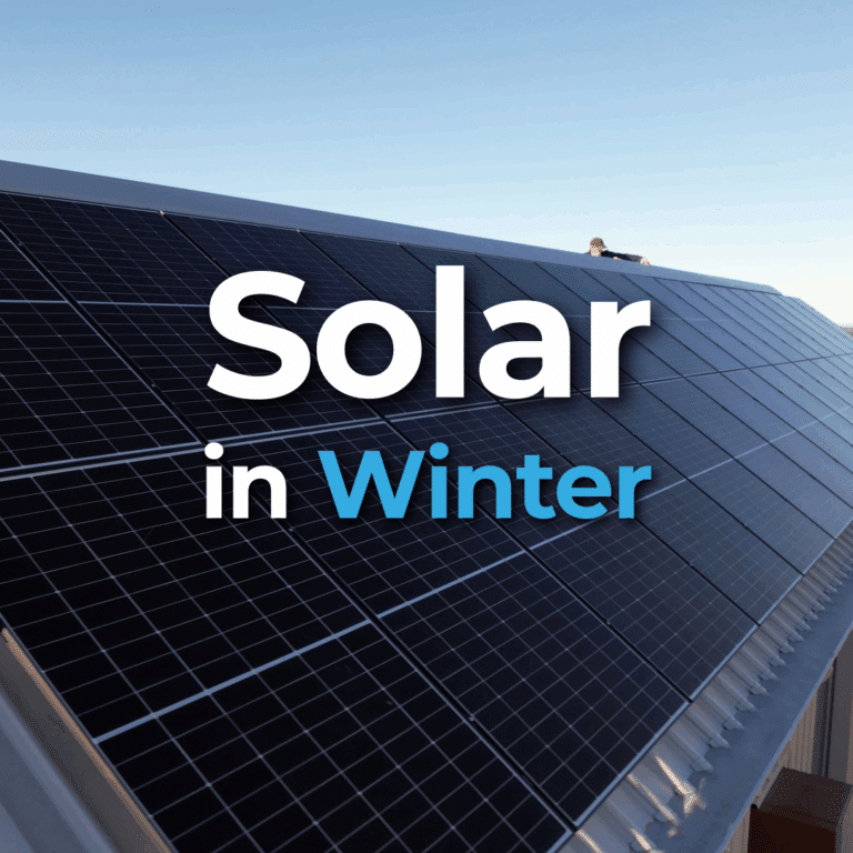 Close-up of solar panels installed on a sloped metal roof under a clear sky, with large text overlay reading "Solar in Winter.